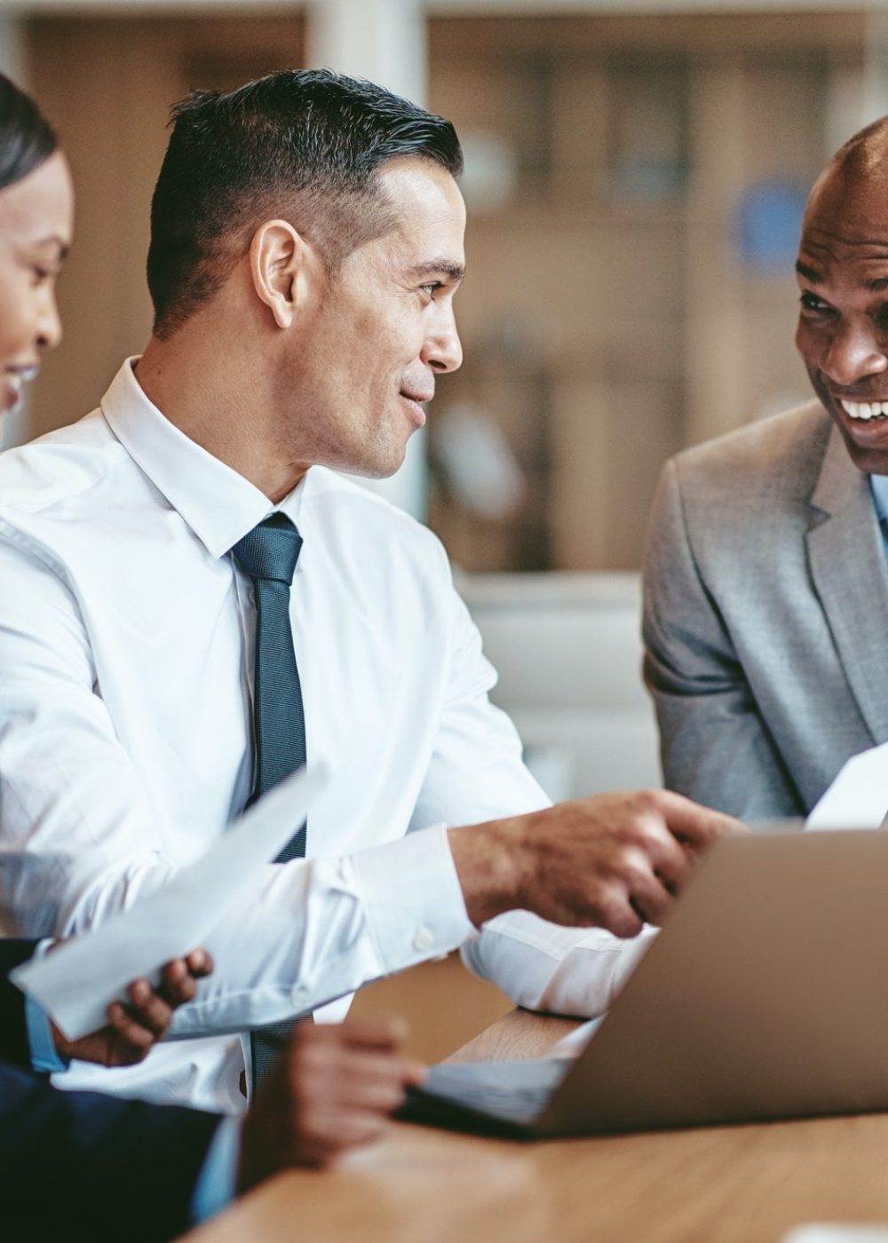smiling-diverse-businesspeople-working-together-in-a-modern-office